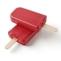 Two vibrant red popsicles with wooden sticks on a white background Royalty Free Stock Photo