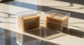 Two decorative soaps in a clear box, sunlight and shadow Royalty Free Stock Photo