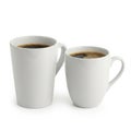 Two white coffee mugs filled with coffee isolated on white background Royalty Free Stock Photo