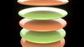 The image features a vertical stack of glossy disc shaped objects on black bg 3d Royalty Free Stock Photo