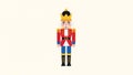 Colorful vintage nutcracker soldier toy standing upright with golden crown and detailed red uniform for holiday decorations and Royalty Free Stock Photo