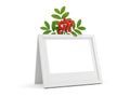 A decorative white picture frame with green leaves and red berries isolated on white background Royalty Free Stock Photo