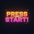 Retro pixelated \'press start!\' text with gradient colors against a starry night sky Royalty Free Stock Photo