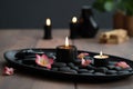 Hot Stone Massage Spa Treatment with Aromatherapy Candles and Dry Flowers Royalty Free Stock Photo