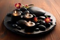 Hot Stone Massage Spa Treatment with Aromatherapy Candles and Dry Flowers Royalty Free Stock Photo