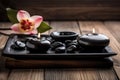 Hot Stone Massage Spa Treatment with Aromatherapy Candles and Dry Flowers Royalty Free Stock Photo