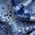 An image featuring an intricate snowflake fabric pattern in shades of blue and silver, evoking a magical and wintry ambiance. Royalty Free Stock Photo