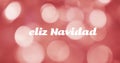 Image of feliz navidad text over red spots of light background Royalty Free Stock Photo