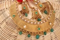 A image of a female jewelry chain with stones.For girls and women matching earrings, mangtika and necklace.