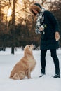 Image of female with labrador in winter park for walk