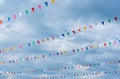 flag line with cloudy sky .