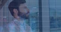 Image of financial data processing over caucasian businessman thinking