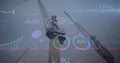 Image of financial data processing over cranes in shipyard Royalty Free Stock Photo