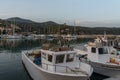 Image of fishing boats parked in Marina di Camerota port during a sunset with mountains Royalty Free Stock Photo