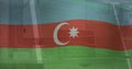 Image of flag of azerbaijan over computer interface against laptop on desk in office Royalty Free Stock Photo