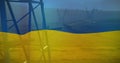 Image of flag of ukraine over field and electricity poles Royalty Free Stock Photo