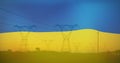 Image of flag of ukraine over field and electricity poles Royalty Free Stock Photo