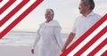 Image of flag of united states of america over senior biracial couple holding hands on beach Royalty Free Stock Photo