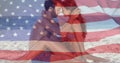 Image of flag of usa over caucasian couple in love on beach in summer Royalty Free Stock Photo