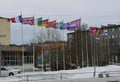 Flags of different countries on central square of city