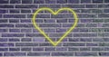 Image of flickering neon social media heart icon on brick wall