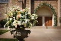 An image of flower with the church doors before a