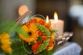 Warm Glow of Candlelight Accentuating a Floral Centerpiece