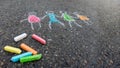 image of four children holding hands. Side view, colored chalk. Copy space. Gray background.