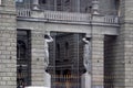 Image of a fragment of the facade of an apartment house with statues of Atlantes in St. Petersburg, Russia