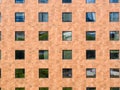 Image of frontal facade of building full of windows. Windows pattern in modern building.