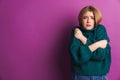 Frozen young woman posing isolated