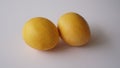 Fruit image: two yellow mangoes on a white background Royalty Free Stock Photo