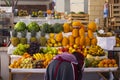 Image of a fruit seller in Peruvian market in Cusco.