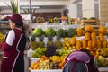 Image of a fruit seller in Peruvian market in Cusco.