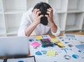 Image of Frustrated stressed businessman and graph document with computer laptop in the workplace