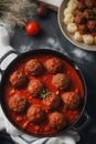 Cooking nine meatballs with tomato sauce