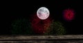 Image of full moon with colourful christmas and new year fireworks exploding in night sky Royalty Free Stock Photo