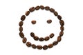 Image of a fun smiley face from a variety of coffee beans