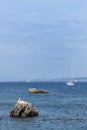 Image of the Galician coast in the northwest of Spain with lighthouses and sailboats on a summer day Royalty Free Stock Photo