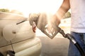 Gas pump in the hand Royalty Free Stock Photo