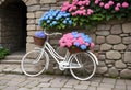 Quaint Old-Fashioned White Bicycle with Hydrangea Flowers in Front of Stone Wall Royalty Free Stock Photo