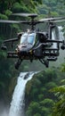 Apache helicopter flying between the green trees in the jungle Royalty Free Stock Photo