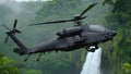 Apache helicopter flying between the green trees in the jungle Royalty Free Stock Photo
