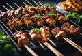 Indonesian lamb satay skewers served on iron hot plate