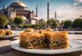 Turkish dessert Baklava with wonderful Hagia Sophia Mosque landscape in Istanbul, Turkey