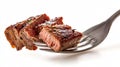 Delicious Slices of Beef Steak on Fork Isolated on White Background Royalty Free Stock Photo