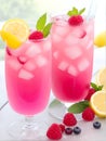 Spring or summer refreshing cold cocktail or mocktail with berries and lemon, raspberry lemonade