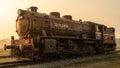 Heavily Rusted Vintage Steam Locomotive at Sunset Royalty Free Stock Photo