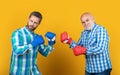 image of generation men fighting wear boxing gloves. two generation men fighting