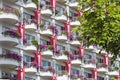 Image of geometric symetric high rise facade with glass windows in Singapore